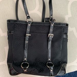 Black canvas Coach bag with the small C pattern